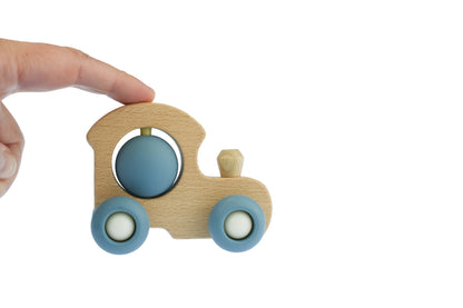 Blue toddler train ride on toy for interactive indoor play, promoting fun and development.