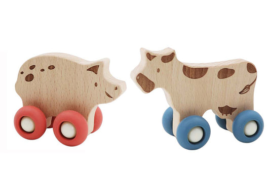 Wooden cow and pig set from Kaper Kidz Ecowheels Farm Movers for imaginative play.