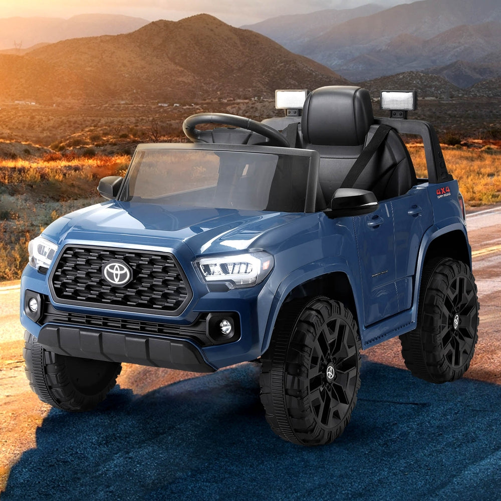 Blue 12V Toyota Tacoma Kids Ride On Car with Remote Control for home fun.