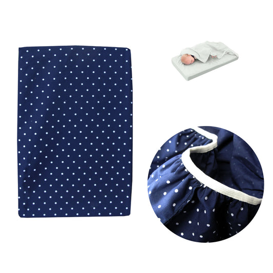 Navy polka dot bassinet fitted sheet with attached flat sheet for cozy baby bedding.