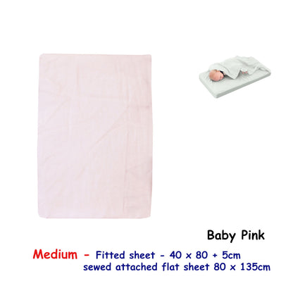 Pink bassinet fitted sheet with attached flat sheet, offering cozy comfort for childrens sleep.