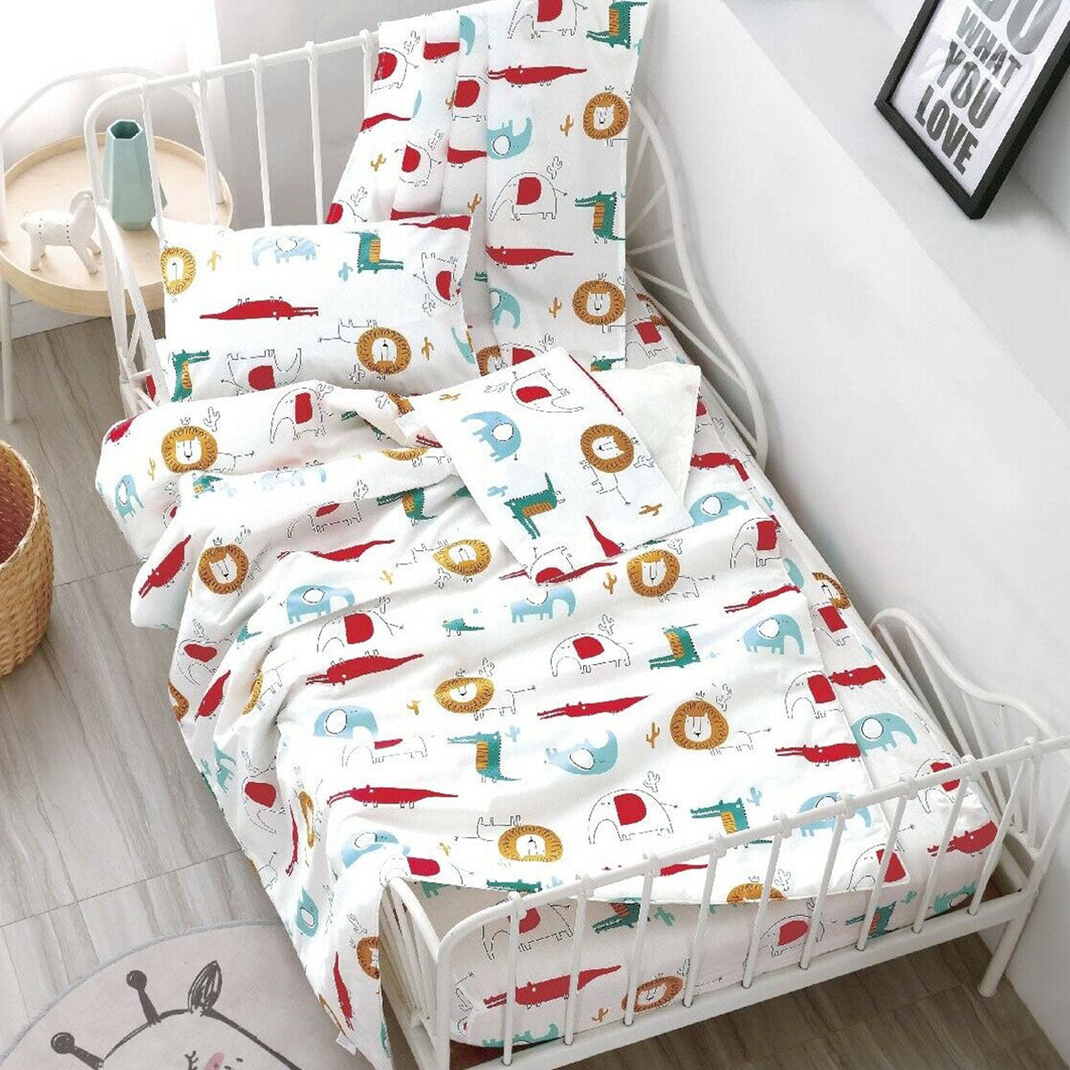Cotton animal print cot sheet set with wild life theme for nursery decor.