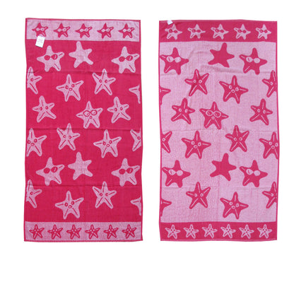 Kids reversible beach towel in hot pink with jacquard velour stars design.