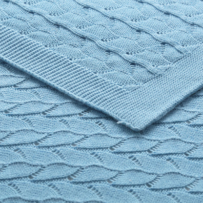 Blue organic cotton baby blanket by Little Gem, soft and hypoallergenic for cozy bedtime.