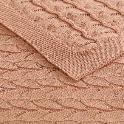 Organic cotton baby blanket in dusty pink, soft & gentle for cozy snuggles.