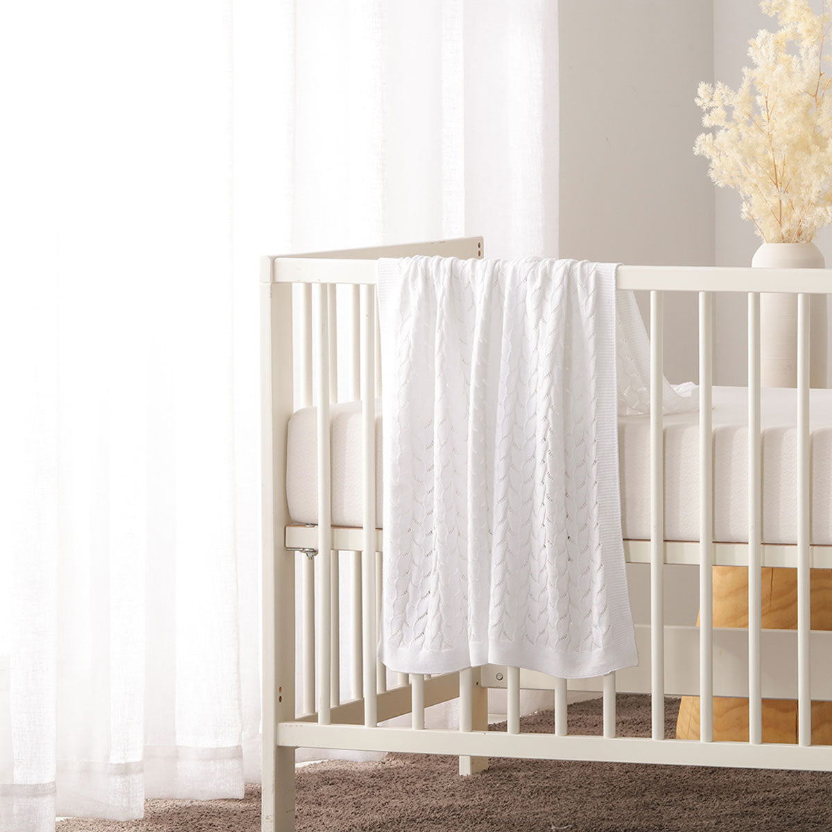 Little Gem organic cotton baby blanket in white, soft and eco-friendly for cozy comfort.