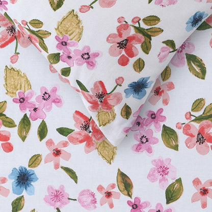 Colorful floral cotton double bed sheet set for kids rooms, creating a cheerful ambiance.