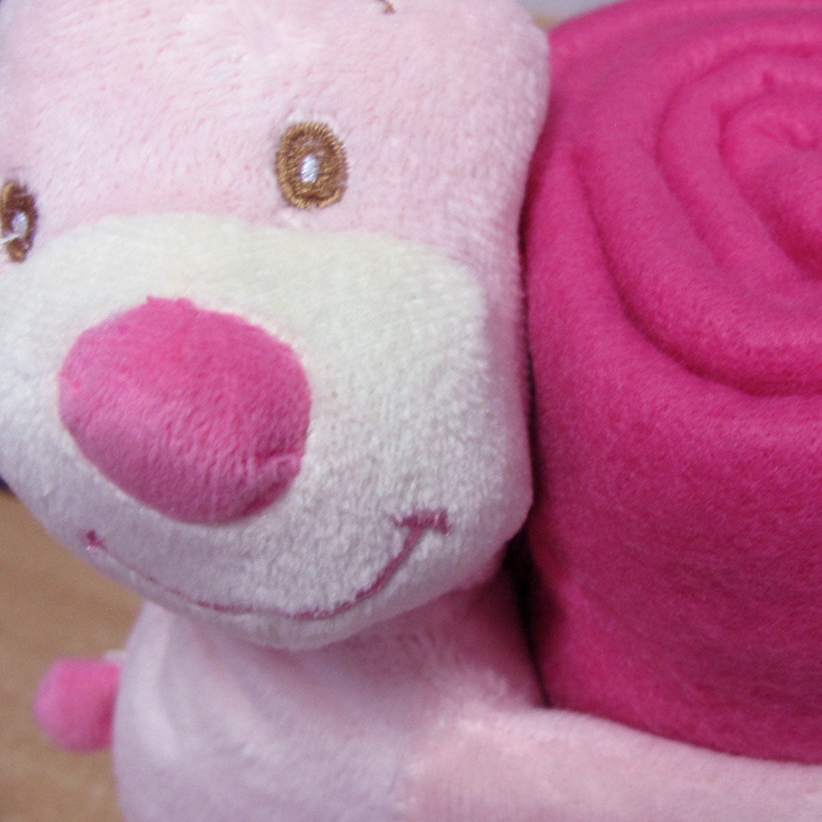 Pink baby blanket with bunny toy for a cozy and adorable addition to childrens bedding.