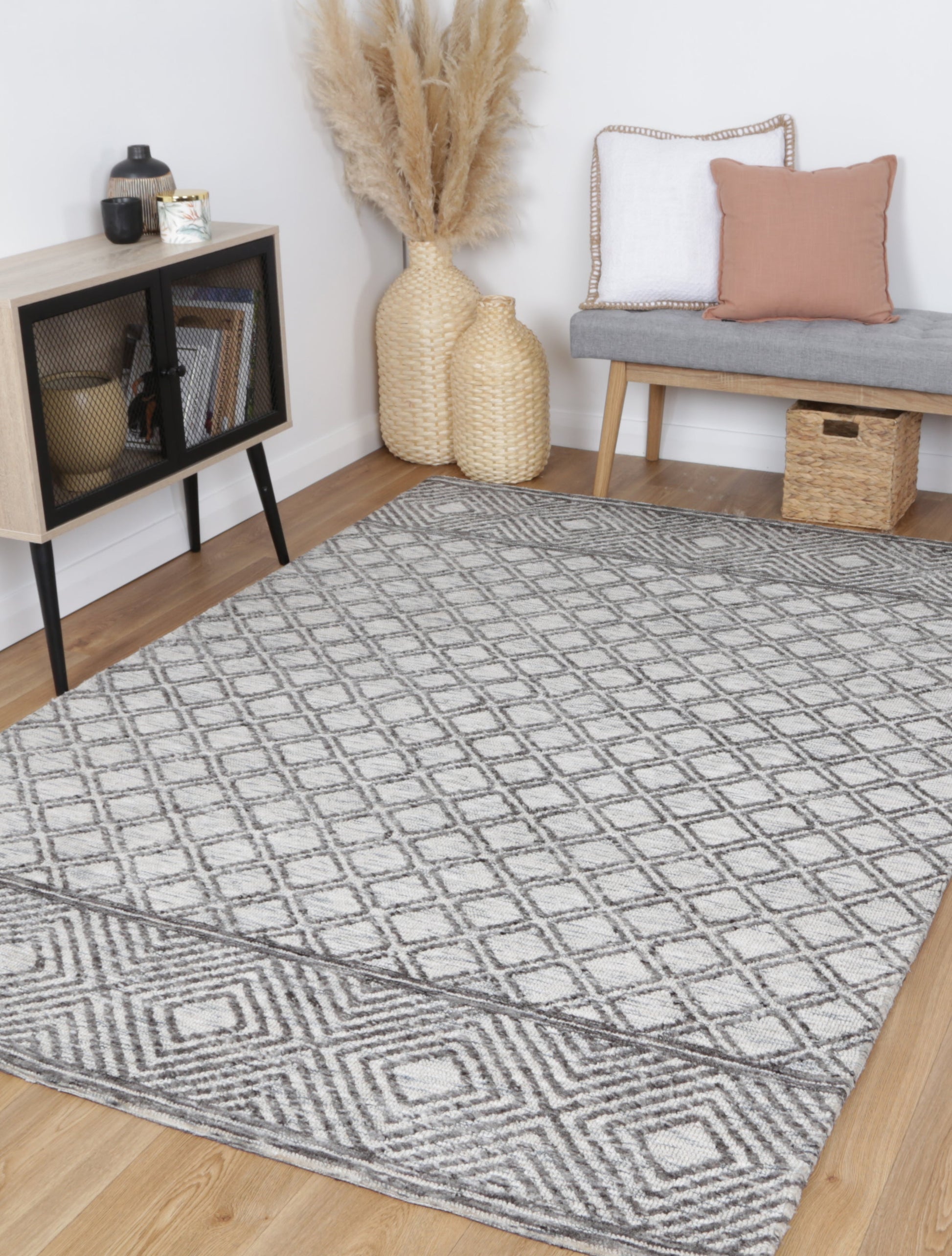 160x230cm polyester rug in tribal charcoal & beige, ideal for childrens playroom or bedroom.