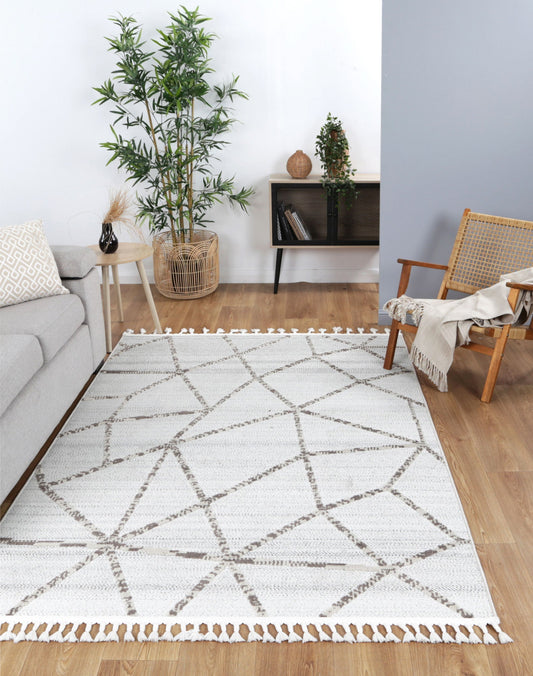 Geometric tribal rug in cream beige, child-friendly polypropylene material, ideal for playrooms.