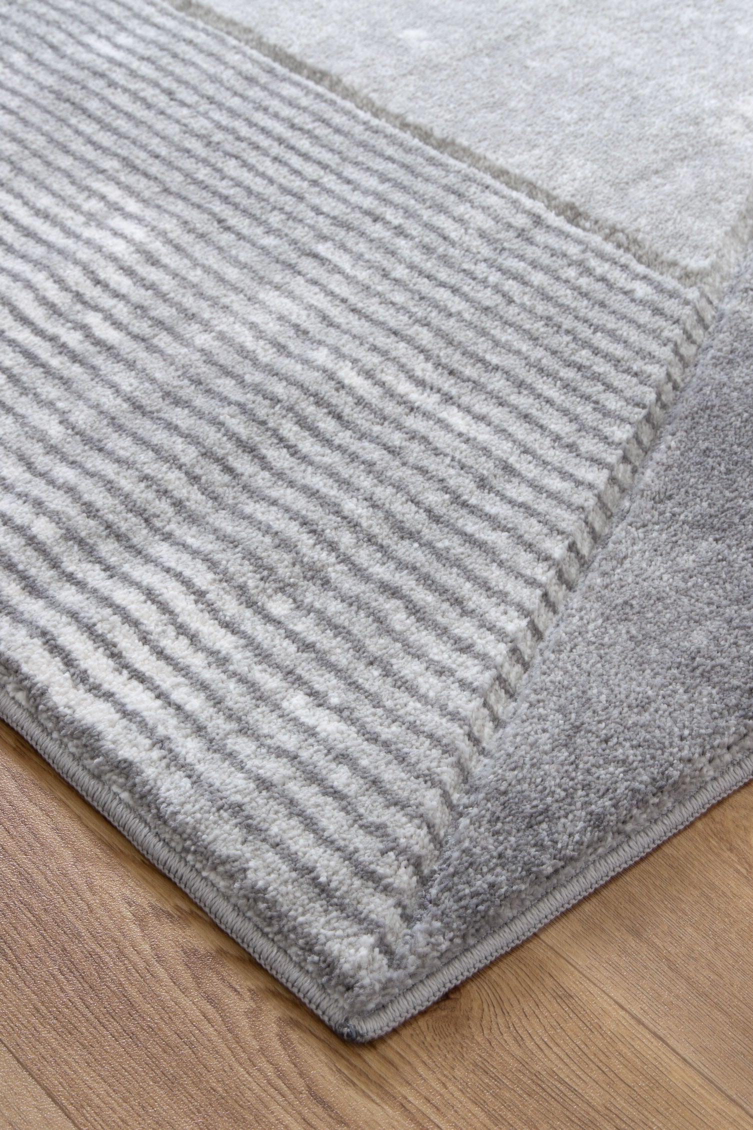 Denver Ivory Grey Hand-Carved Rug 240x330cm. Soft, durable polypropylene rug for cozy kids spaces.