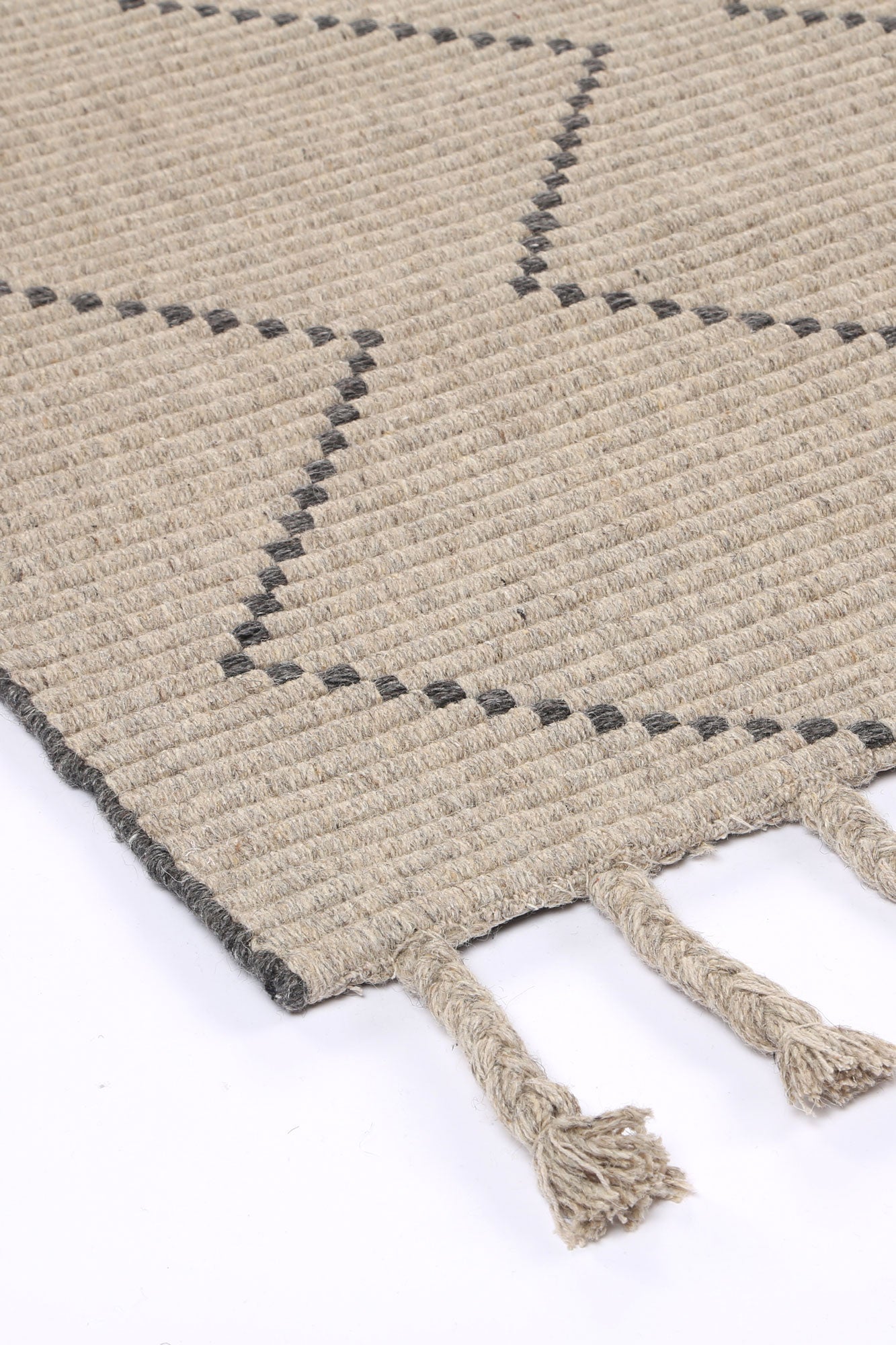 Handcrafted gray tribal wool blend rug with geometric pattern, ideal for kids bedroom decor.