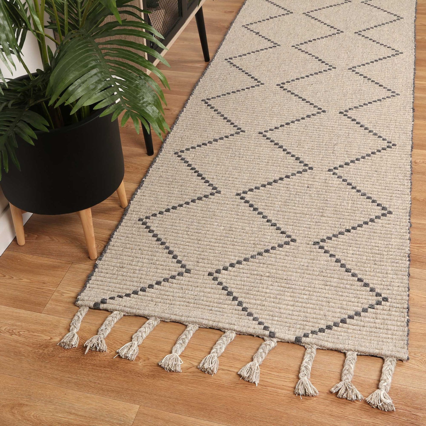 Gray tribal wool rug with geometric pattern, 160x230cm, perfect for kids play area.