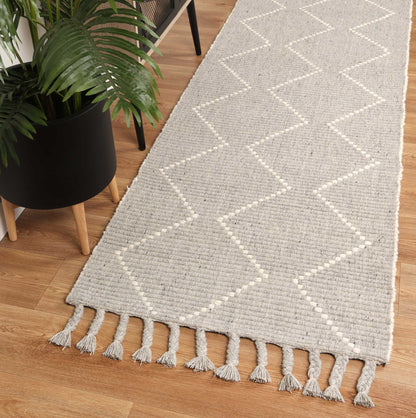 Kids grey tribal wool blend rug with intricate pattern for cozy and stylish play area.