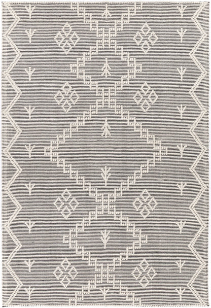 Soft cream wool blend rug with tribal pattern, perfect for kids room decor.