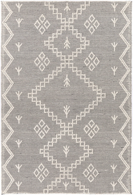 Soft cream wool blend rug with tribal pattern, perfect for kids room decor.