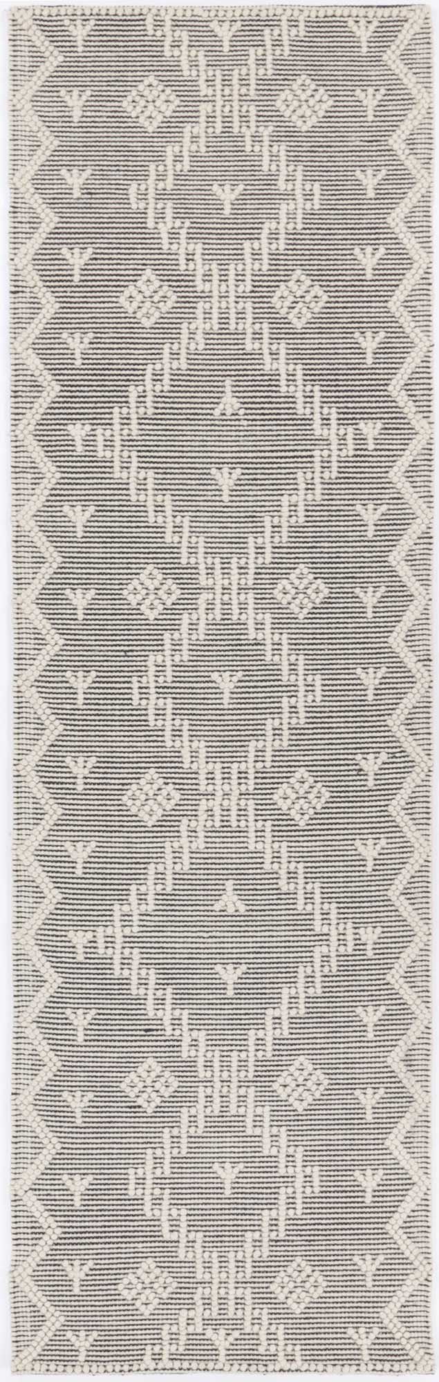 Kids cream tribal wool blend area rug, ideal for adding warmth and style to playrooms.