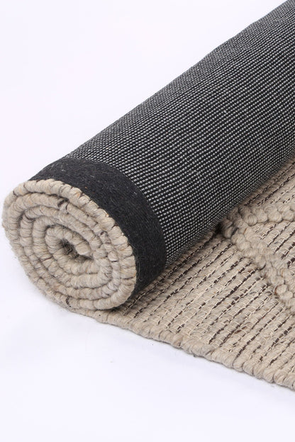Kids cream wool blend rug featuring tribal geometric design in 200x290cm size.