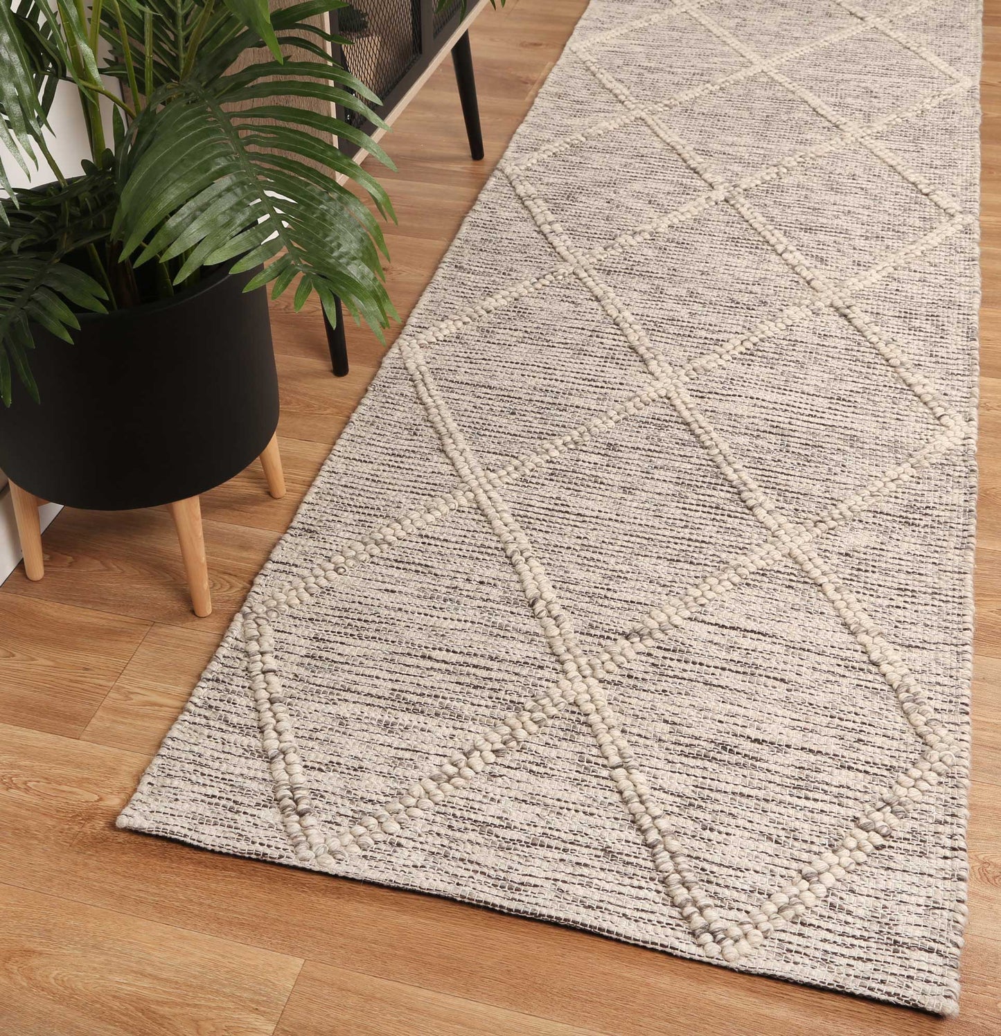 Cream tribal geometric wool blend rug, 200x290cm, ideal for enhancing kids playrooms and bedrooms.