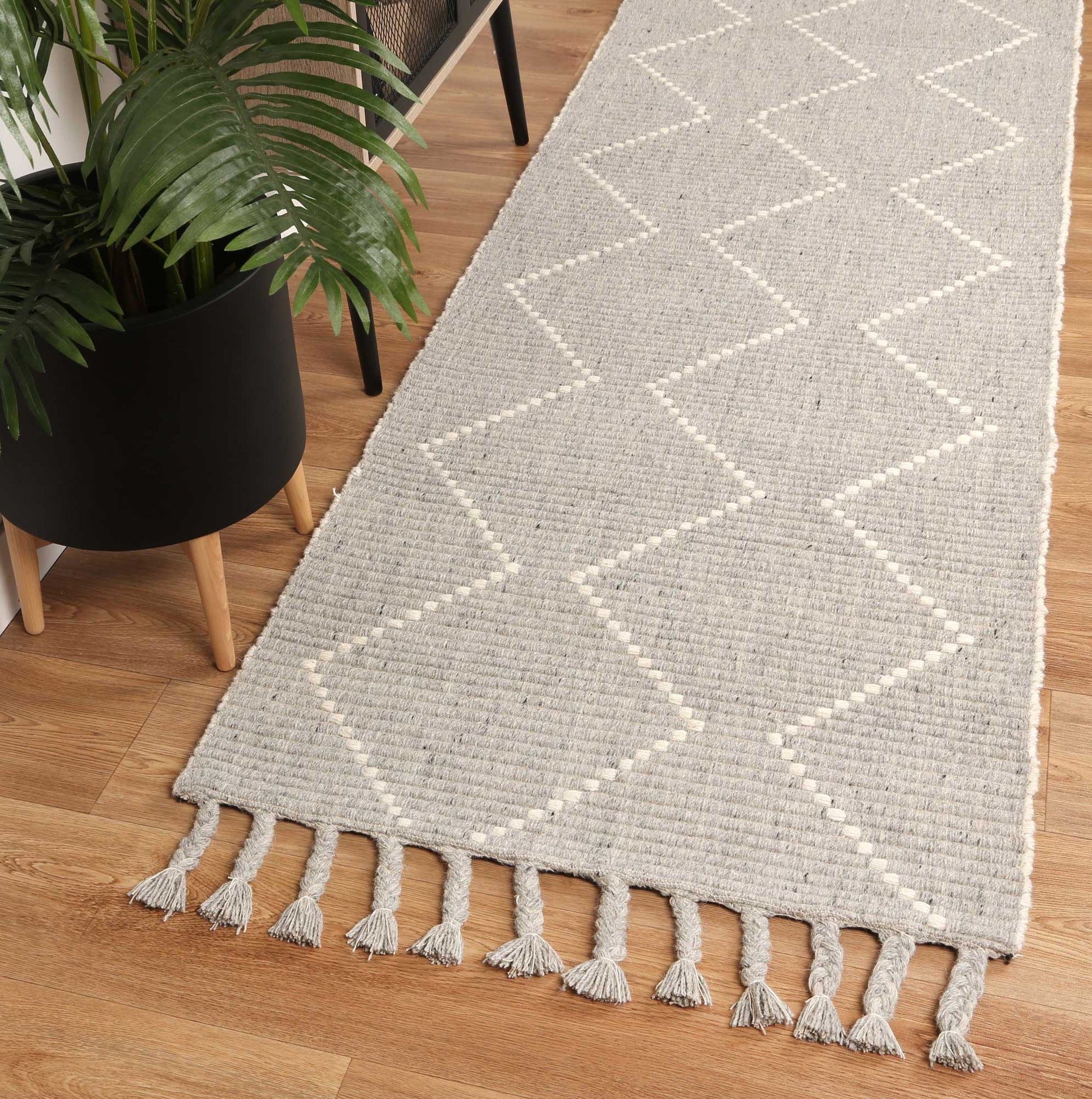 Grey tribal geometric rug, ideal for kids rooms, 200x290cm; playful design, soft wool blend.