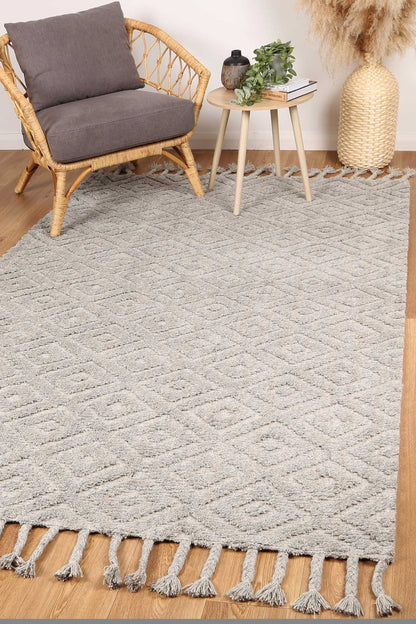Grey tribal wool blend rug ideal for kids rooms, 200x290 cm, adds playful charm.