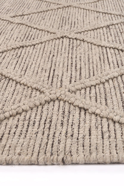 Geometric tribal wool blend rug in cream, 240x330cm, ideal for a childs playroom or bedroom.