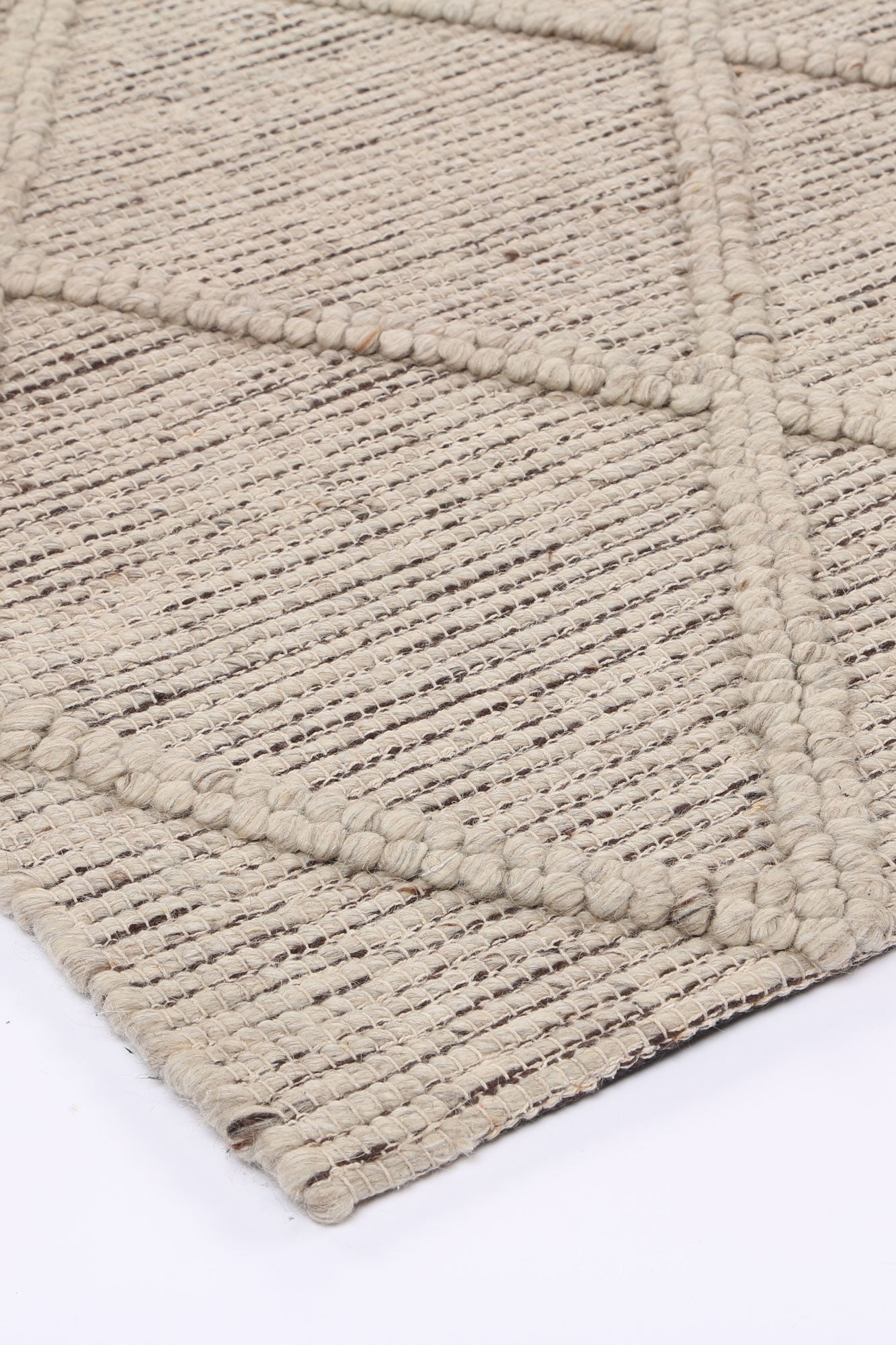 Geometric tribal wool blend rug in cream, ideal for a childrens room decor.