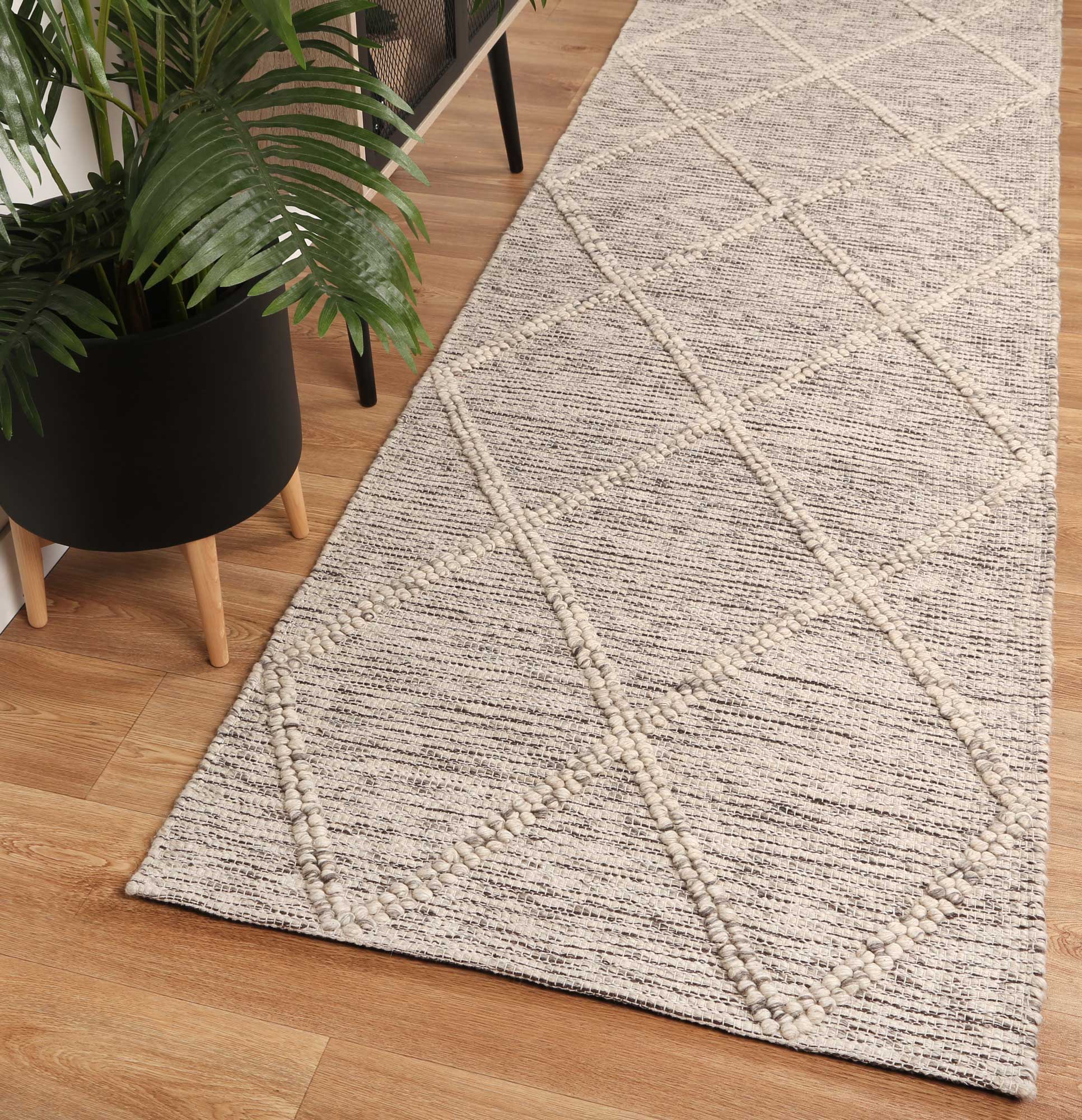 Geometric tribal wool blend rug in cream, 240x330cm, ideal for childrens room dÃ©cor.