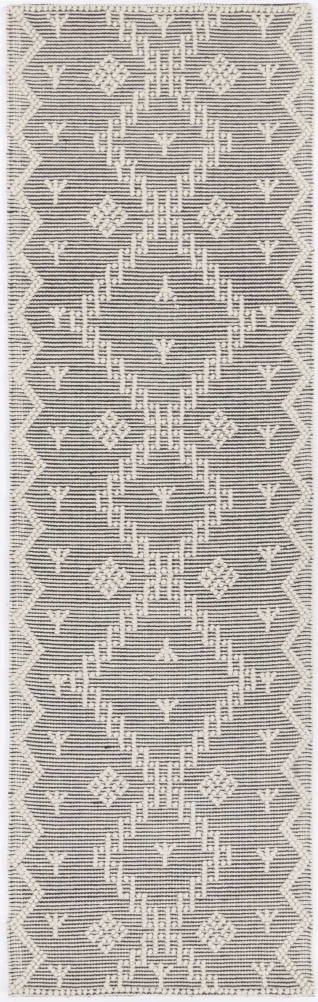 Geometric tribal rug with cream tones, ideal for childrens play area or bedroom decor.
