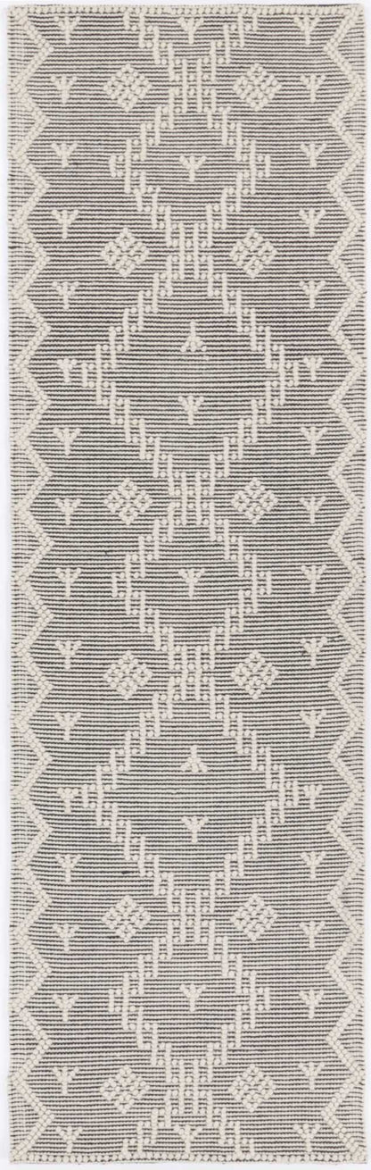 Geometric tribal rug with cream tones, ideal for childrens play area or bedroom decor.