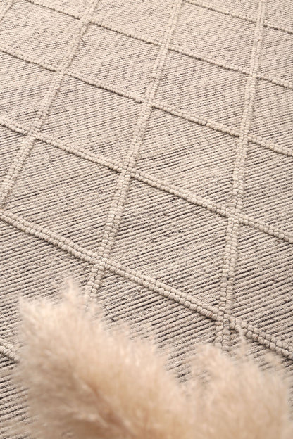 Hand-tufted tribal rug in cream, 300x400 size ideal for childrens play area.