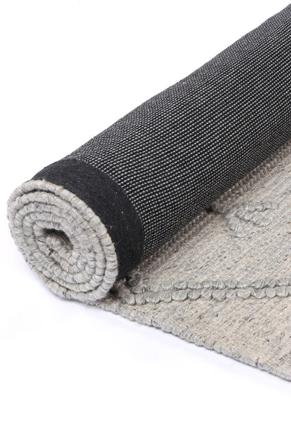 Kids tribal wool blend rug in grey with geometric pattern - perfect for playrooms.