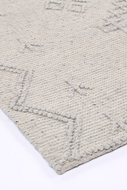 Kids tribal wool blend area rug, featuring grey geometric pattern, ideal for cozy play areas.