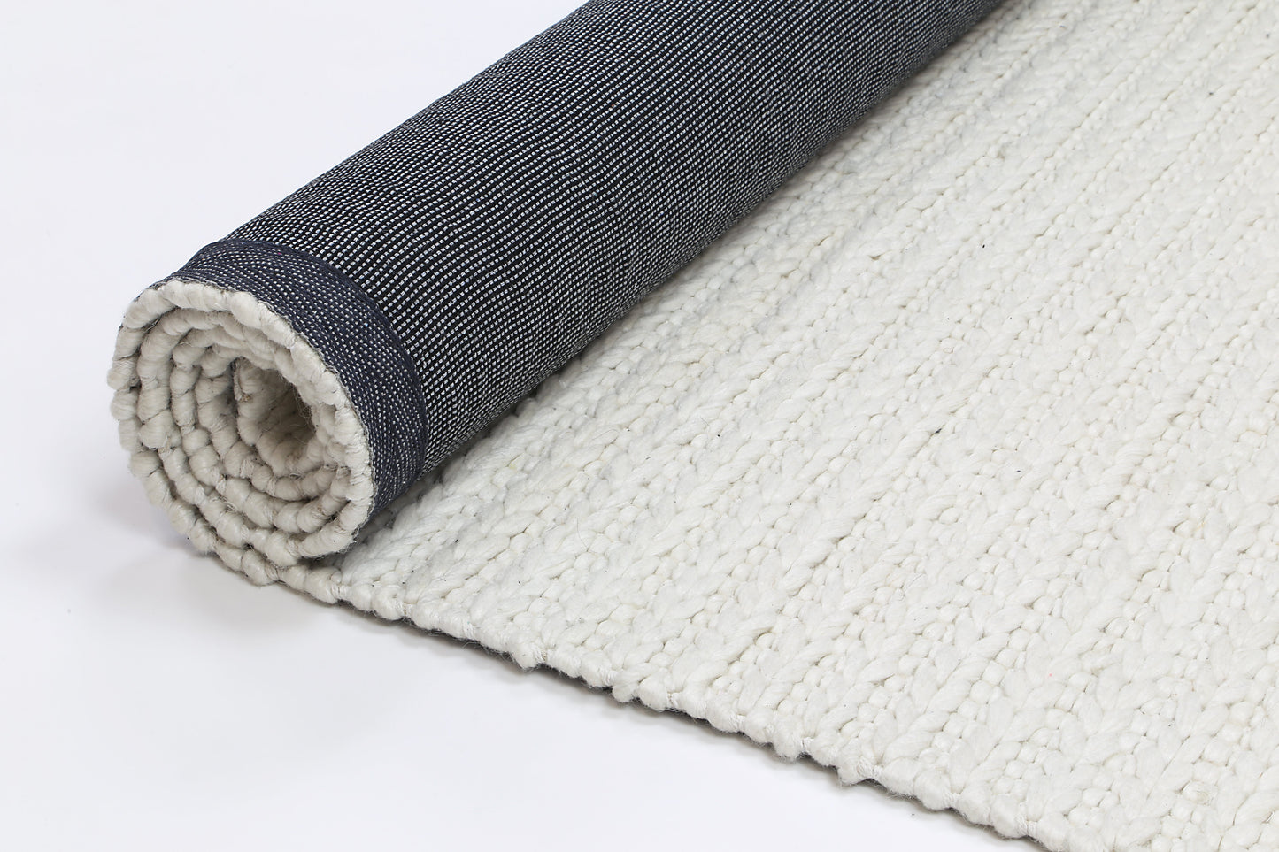 White wool blend tribal rug with soft texture, ideal for childrens play or nursery decor.