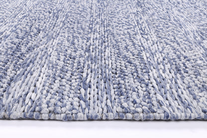 Blue tribal rug with wool blend texture, perfect for kids play area or bedroom.