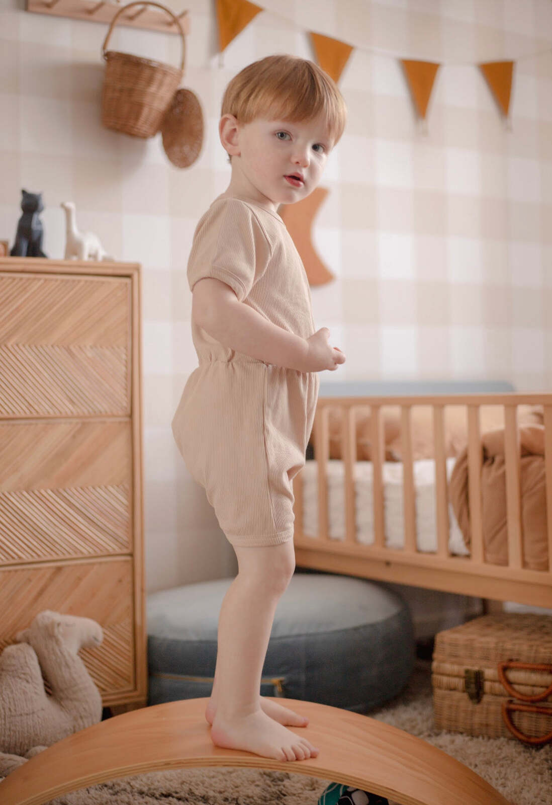 Ribbed cotton romper in sugar cookie color, perfect for babies aged 0-3 months.