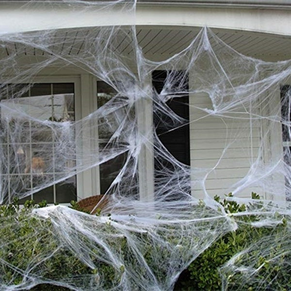 Stretchable Spider Web Halloween Decoration with 2 Spiders, perfect for spooky kids parties.