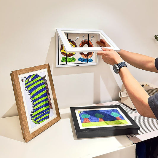 Kids art display frame with magnetic front opening, holds up to 150 pieces.