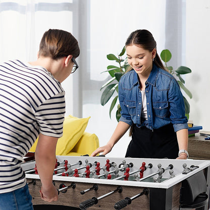 Wooden foosball table for kids and adults; compact design for indoor/outdoor fun at home.