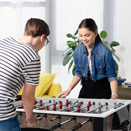 Wooden foosball table for kids and adults; compact design for indoor/outdoor fun at home.