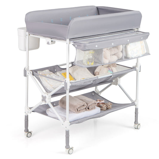 Grey wheeled diaper changing station folds for portability and features waterproof design for easy cleaning.