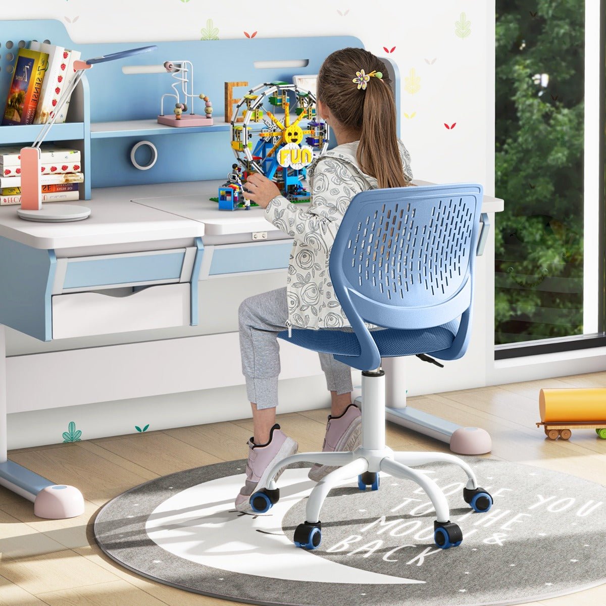 Blue adjustable ergonomic kids desk chair for comfortable study space at home.