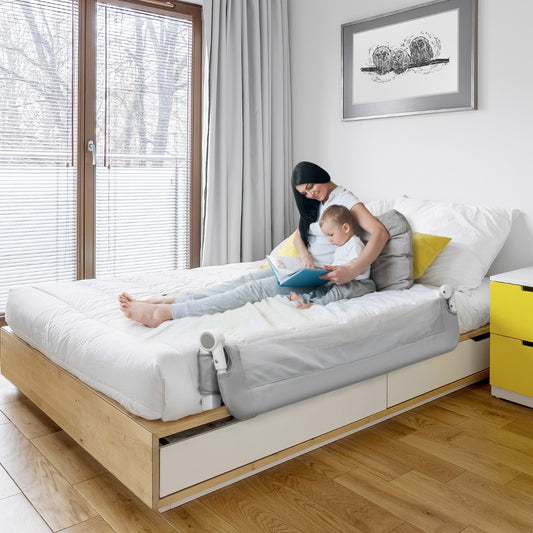 Foldable bed rail guard for toddler safety, adjustable design for easy installation and storage.