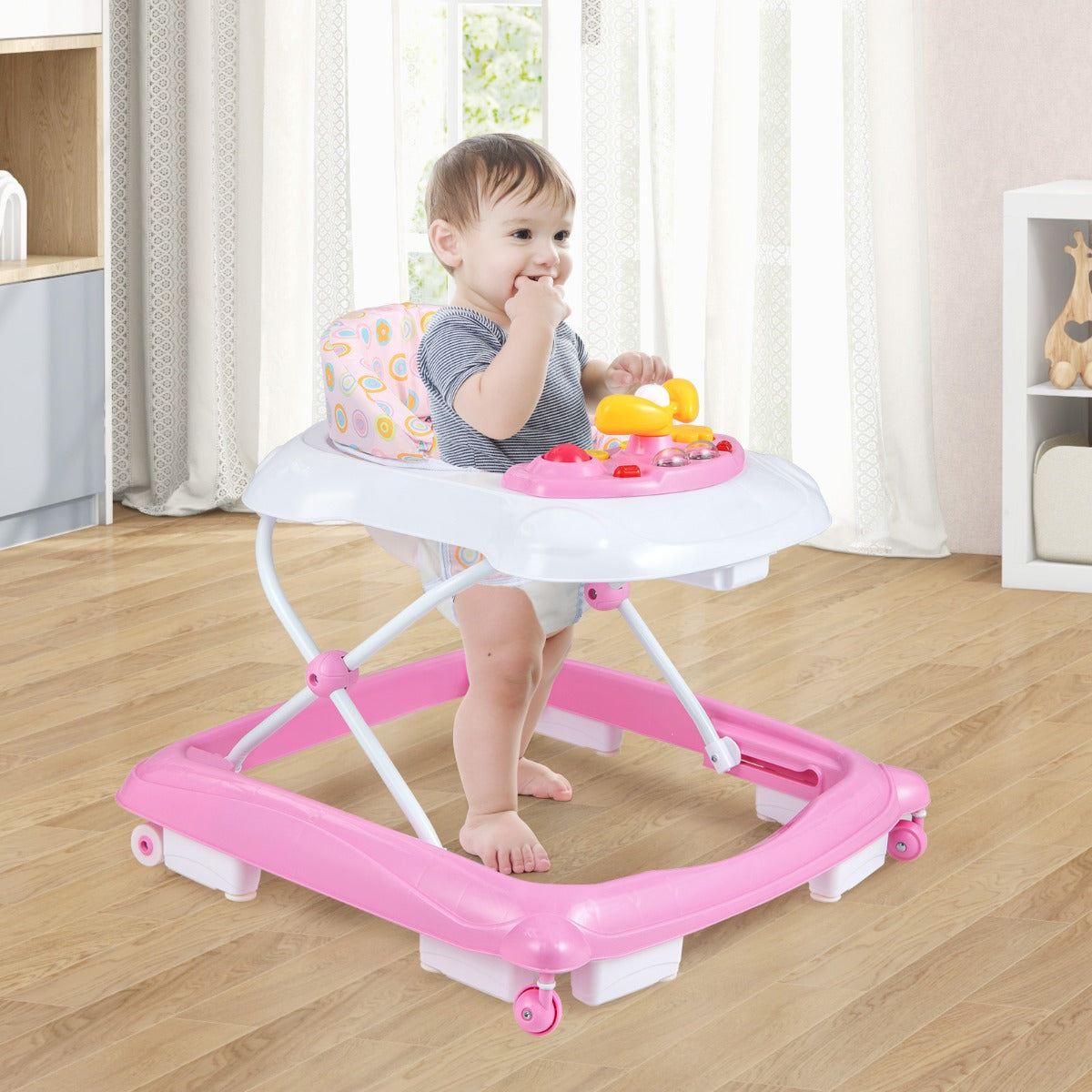 Pink foldable baby walker with adjustable heights, music tray and lights at Kids Mega Mart.