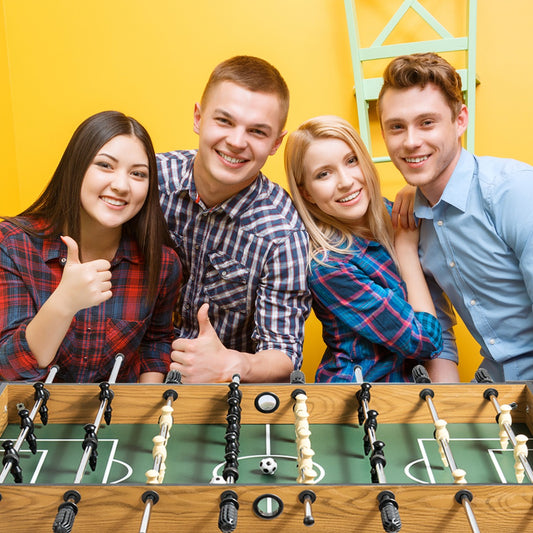 Wooden kids foosball table with score counter and 2 balls for indoor soccer game fun.