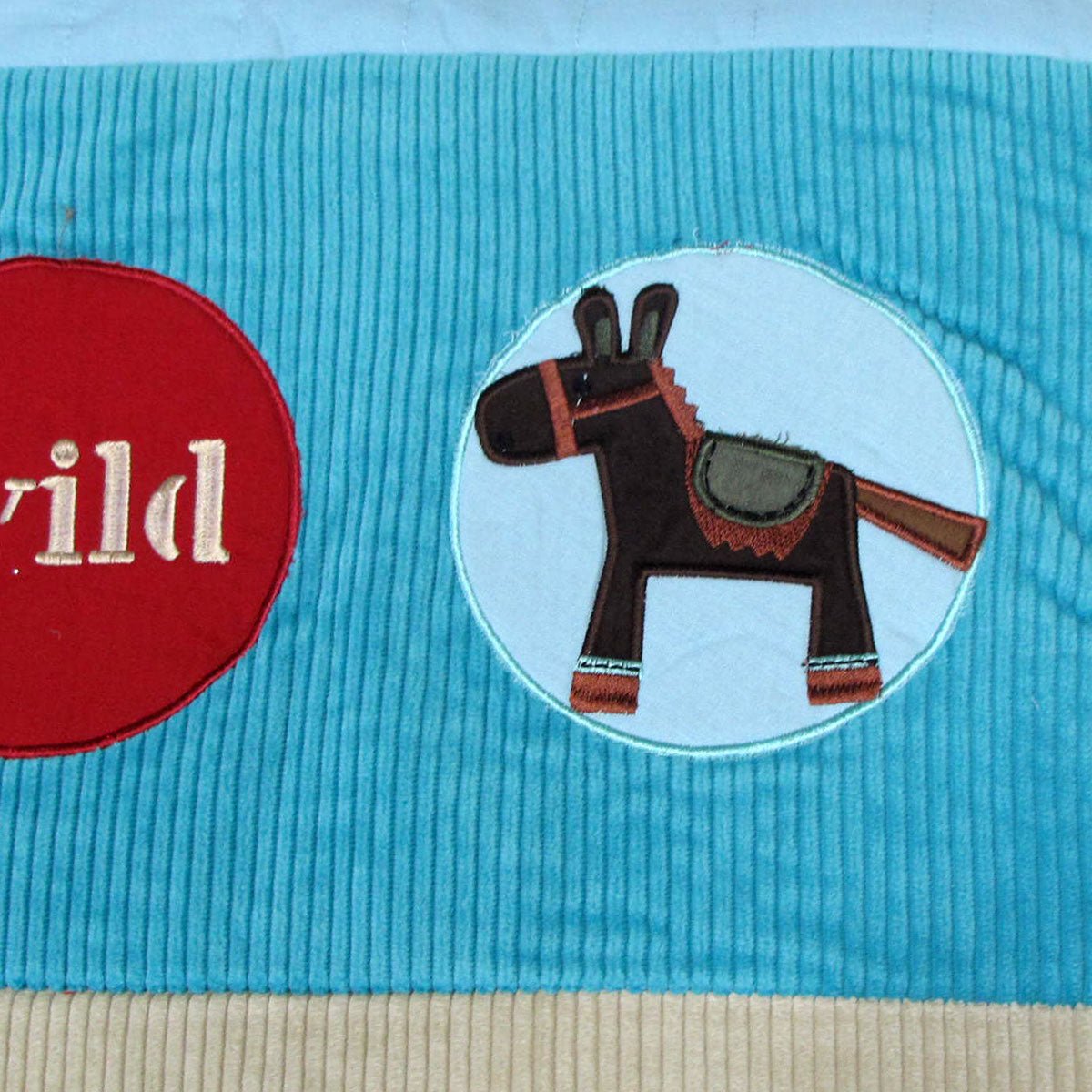 Wild West-themed blue comforter and cushion set for kids bedroom decor.