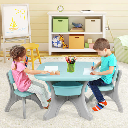 Green kids table and chair set with storage boxes for play and learning activities.