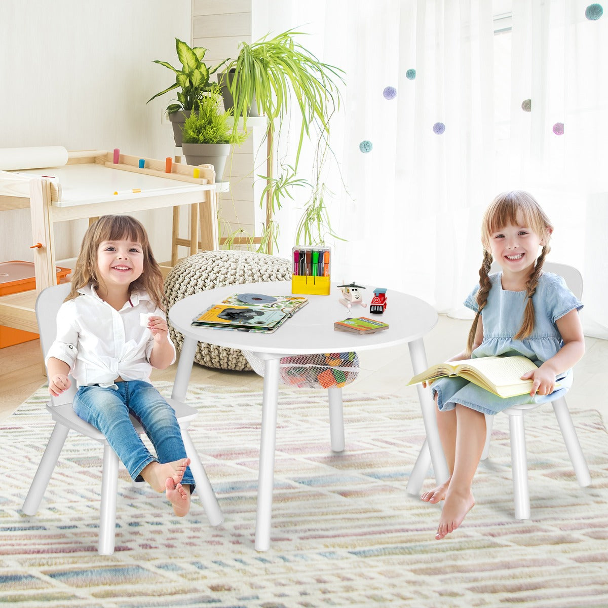 Kids white table and chairs set with storage, perfect for play and study time.