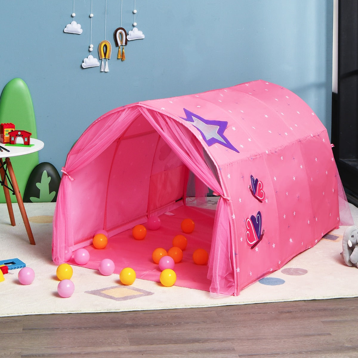 Kids pink playhouse tent with carry bag, perfect for imaginative indoor play and sleepovers.