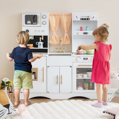 Kids wooden play kitchen set with microwave, coffee maker and accessories for imaginative play.